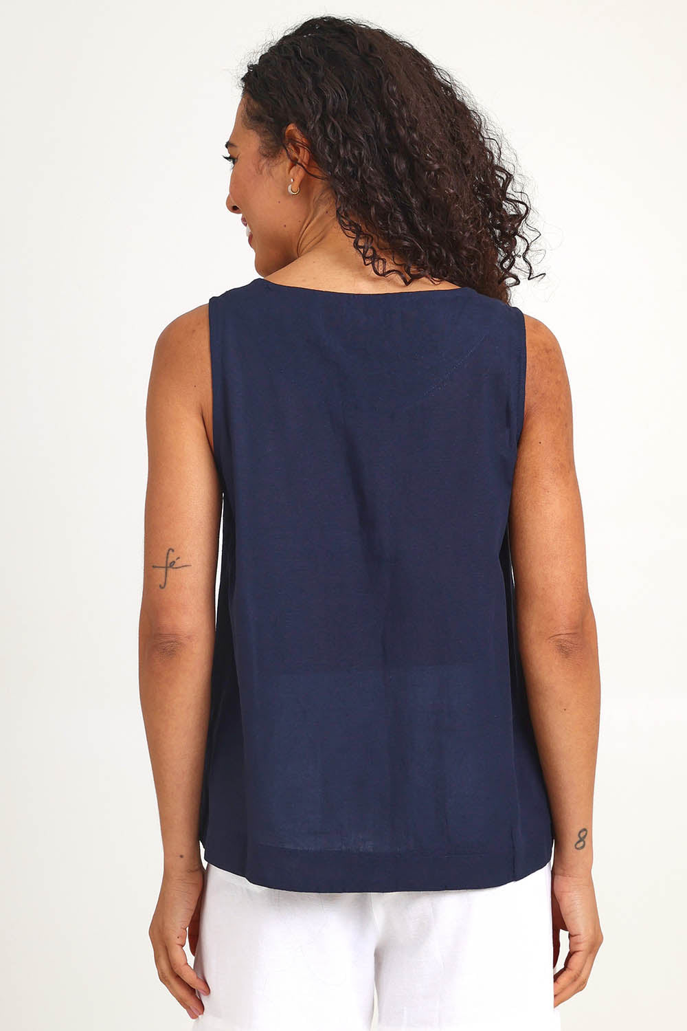 Model Pamelar wearing size 10 of the Essentials Linen Blend Cami - Navy in colour Navy, from the back
