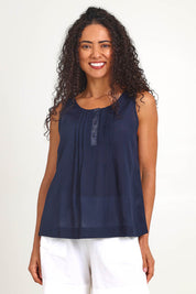 Model Pamelar wearing size 10 of the Essentials Linen Blend Cami - Navy in colour Navy, in a cropped view