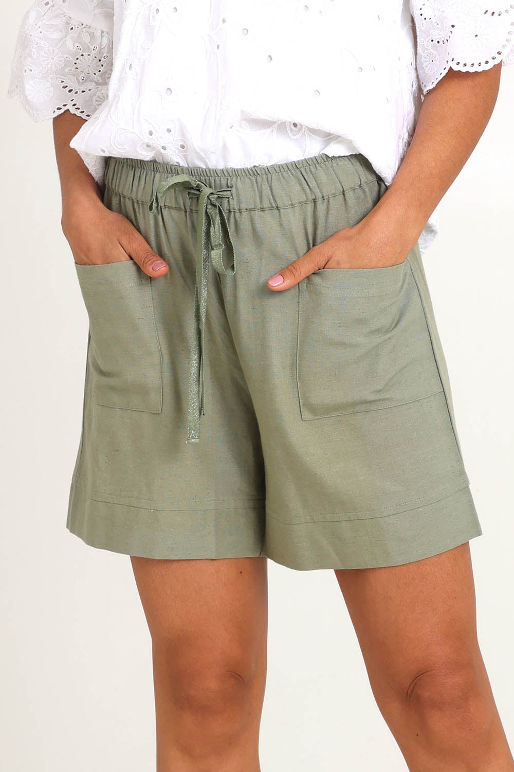 Model Pamelar wearing size 10 of the Essentials Linen Blend Shorts - Khaki in colour Khaki, in a cropped view