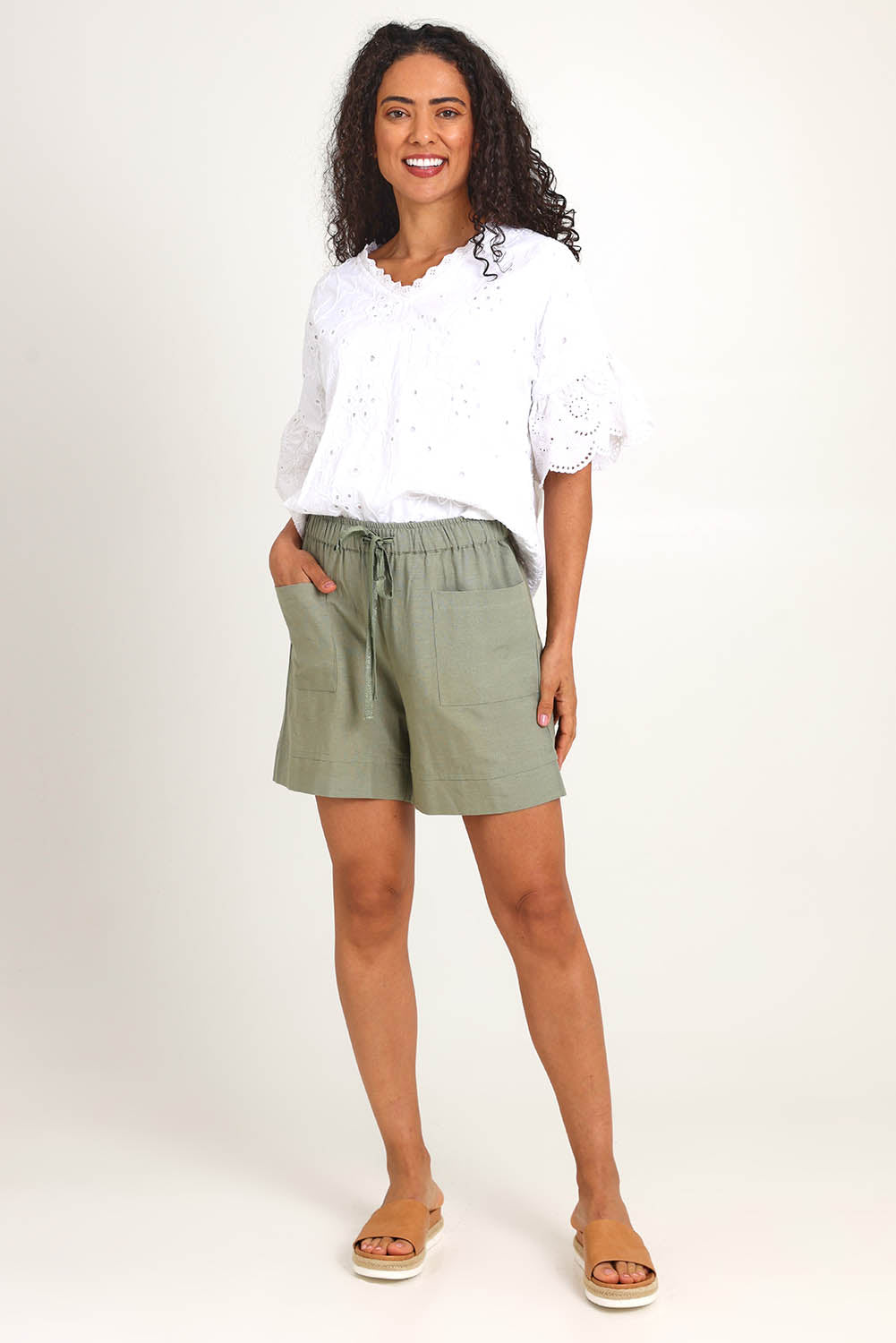 Model Pamelar wearing size 10 of the Essentials Linen Blend Shorts - Khaki in colour Khaki, from the front