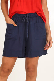 Model Pamelar wearing size 10 of the Essentials Linen Blend Shorts - Navy in colour Navy, in a cropped view