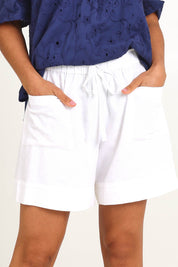 Model Pamelar wearing size 10 of the Essentials Linen Blend Shorts - White in colour White, in a cropped view