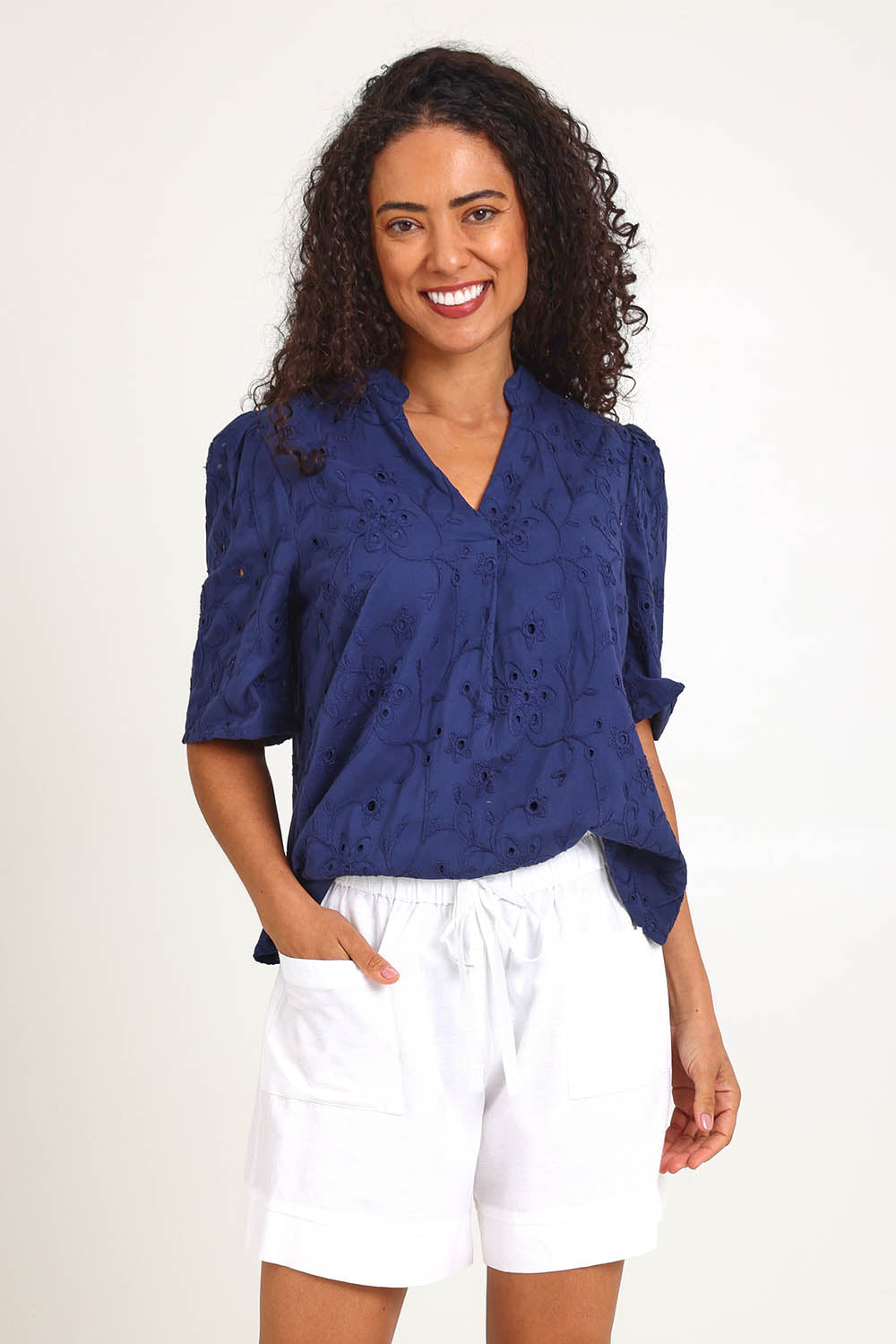 Model Pamelar wearing size 10 of the Essentials Linen Blend Shorts - White in colour White, in a cropped view