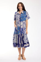 Model Genericm wearing size sample of the Long Patch Dress – Print in colour Print, from the front