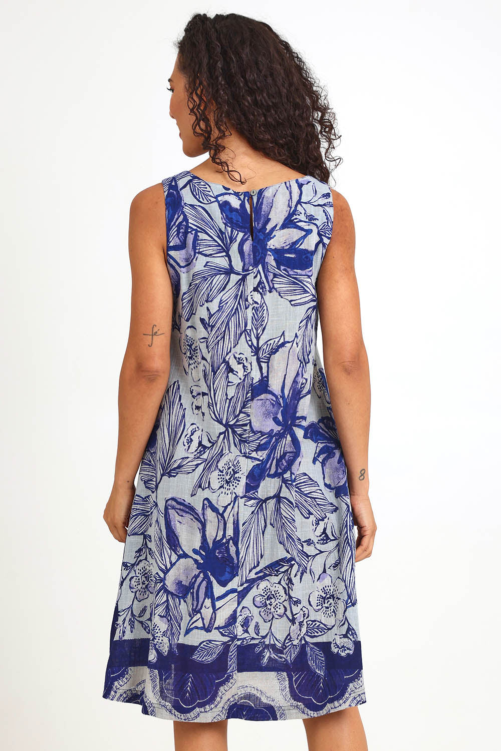Model Pamelar wearing size 10 of the Sleeveless Midi Dress – Print in colour Print, from the back