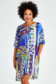 Model Olivia wearing size 10 of the Digital Shift Dress in colour Mix5 (Blue), from the front, cropped image