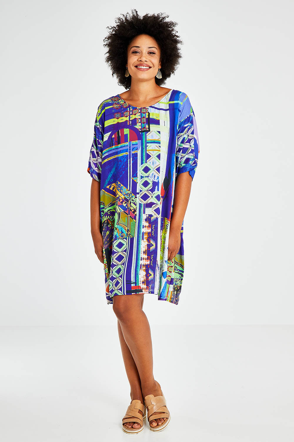 Model Olivia wearing size 10 of the Digital Shift Dress in colour Mix5 (Blue), from the front, showing the whole outfit