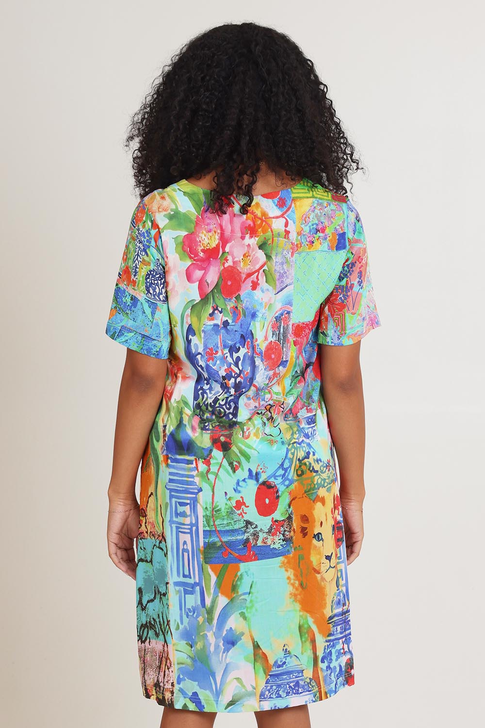 Model Ziara wearing size 10 of the Digital Shift Dress in colour Oriental, from the back