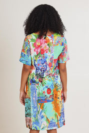 Model Ziara wearing size 10 of the Digital Shift Dress in colour Oriental, from the back