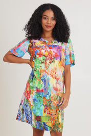 Model Ziara wearing size 10 of the Digital Shift Dress in colour Oriental, from the front, cropped image