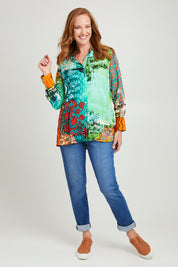 Model Katie wearing size 10 of the Digital Long Collar Shirt in colour Mix4 (Green), from the front, showing the whole outfit