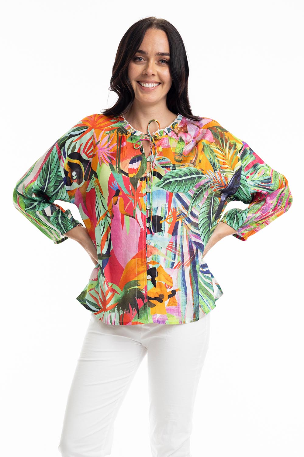 A model wearing the Rio Frill Neck Top in colour Rio (Green), from the front, cropped image