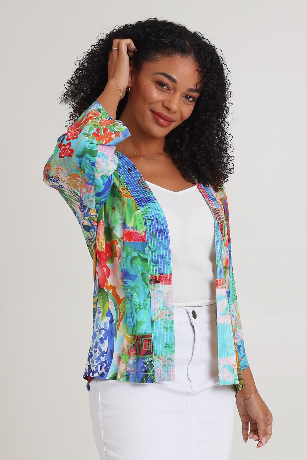 Model Ziara wearing size 10 of the Digital Kimono in colour Oriental, from the front, cropped image