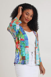 Model Ziara wearing size 10 of the Digital Kimono in colour Oriental, from the front, cropped image