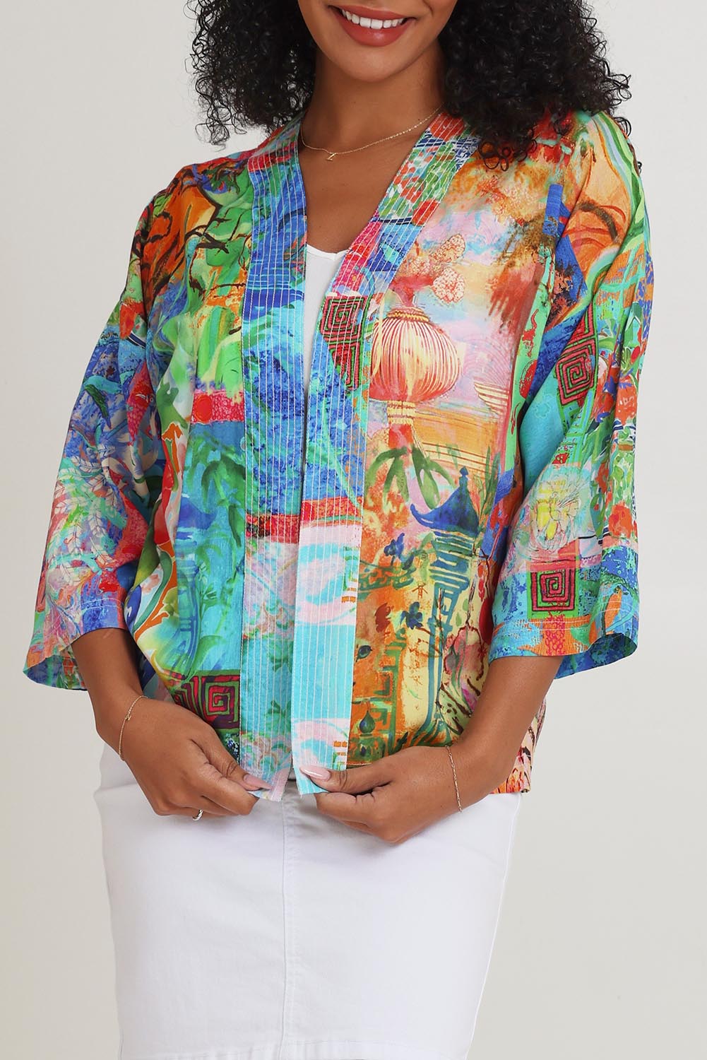 Model Ziara wearing size 10 of the Digital Kimono in colour Oriental, from the front, cropped image