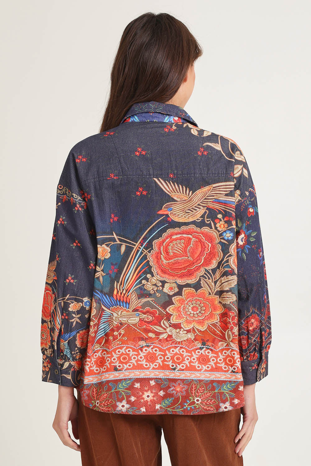 Model Madeline wearing size 10 of the Cord Shirt in colour Embroidery (Blue), from the back