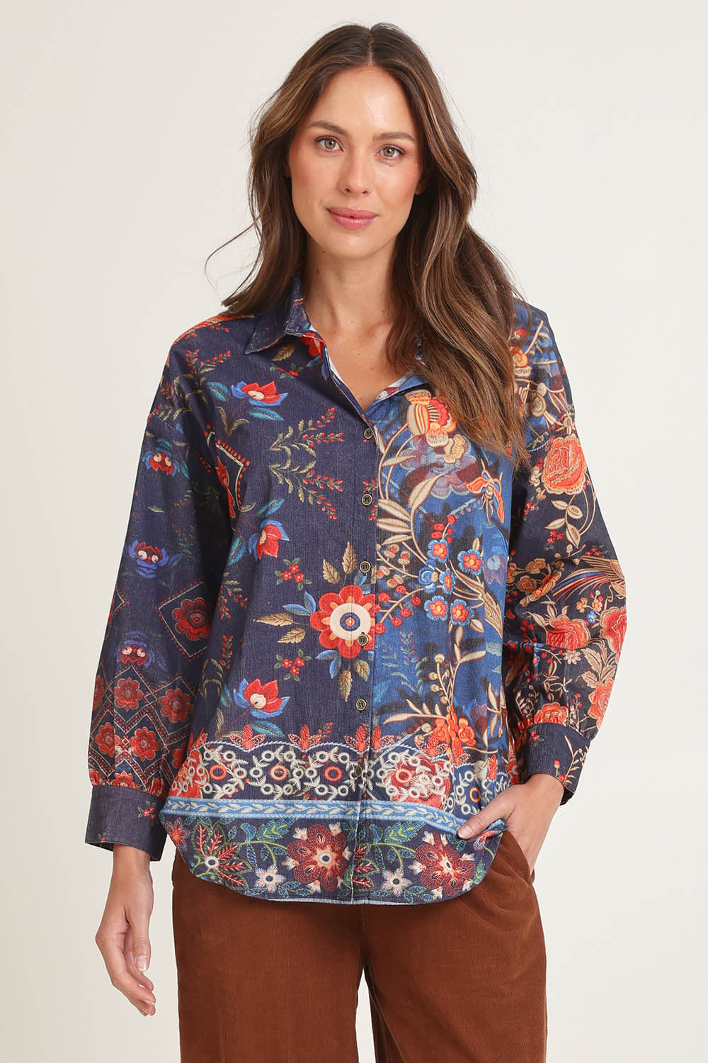 Model Madeline wearing size 10 of the Cord Shirt in colour Embroidery (Blue), from the front, cropped image