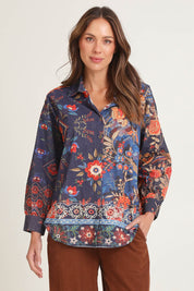 Model Madeline wearing size 10 of the Cord Shirt in colour Embroidery (Blue), from the front, cropped image