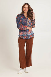 Model Madeline wearing the Cord Shirt in colour Embroidery (Blue), from the front, showing the whole outfit