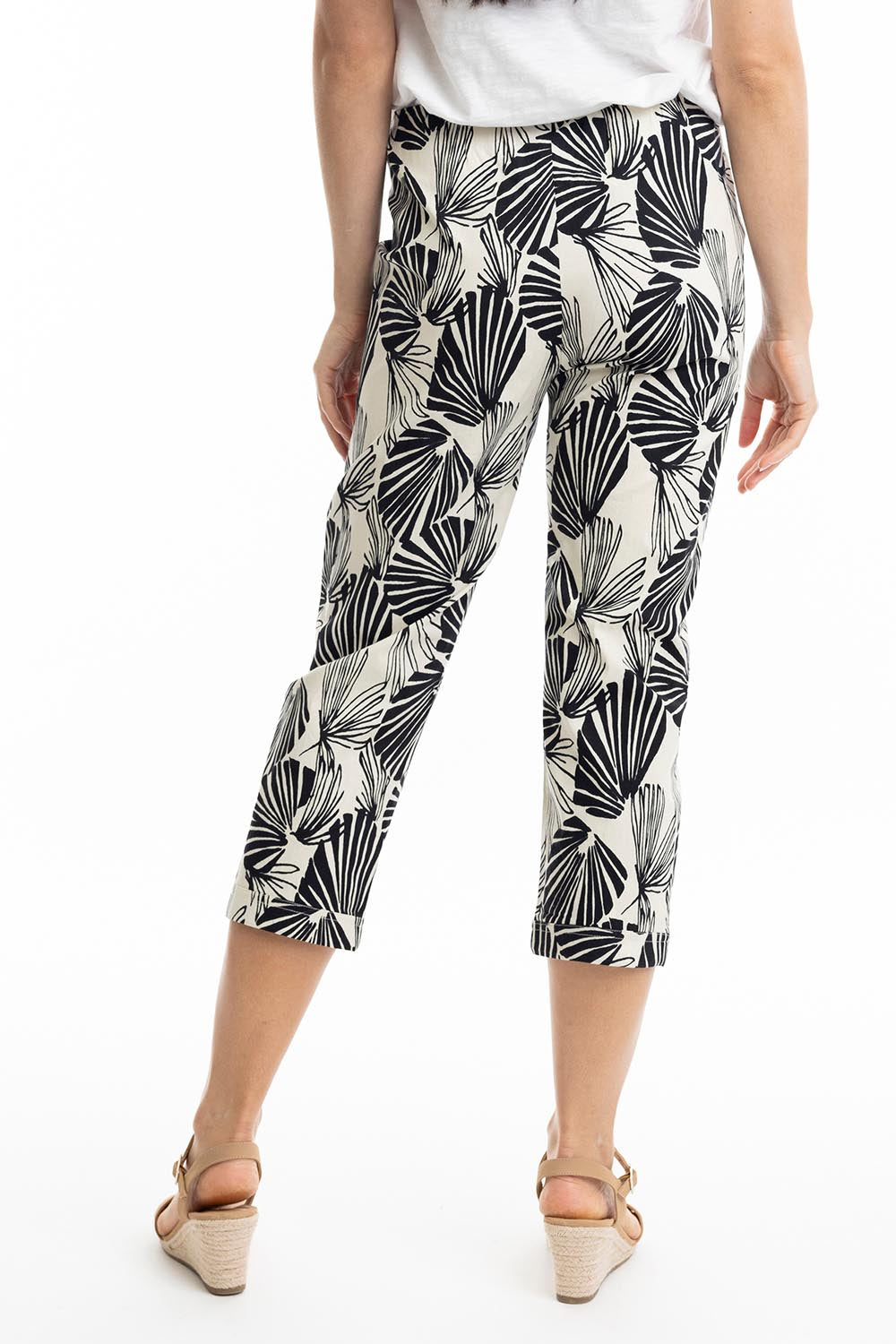 A model wearing the Papagayo Cotton Pant in colour Print (Black), from the back