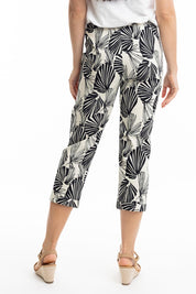 A model wearing the Papagayo Cotton Pant in colour Print (Black), from the back