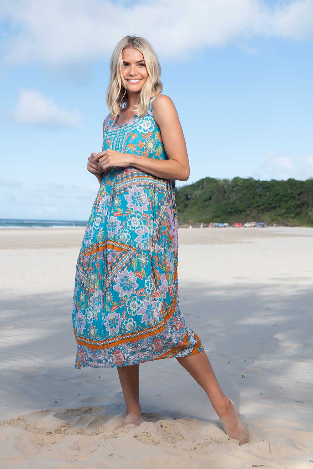 A model wearing the Iruya Organic Cotton Bubble Dress in colour Blue (Blue), from the front, showing the whole outfit