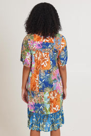 Model Ziara wearing size 10 of the Bib Dress in colour Miramir, from the back