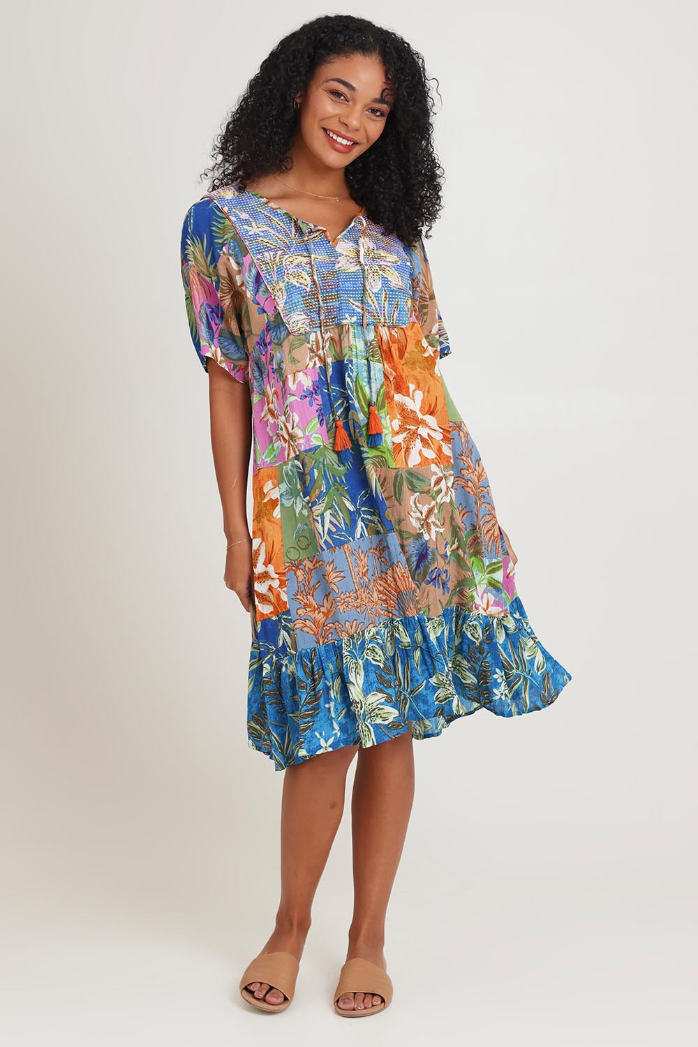 Model Ziara wearing size 10 of the Bib Dress in colour Miramir, from the front, showing the whole outfit