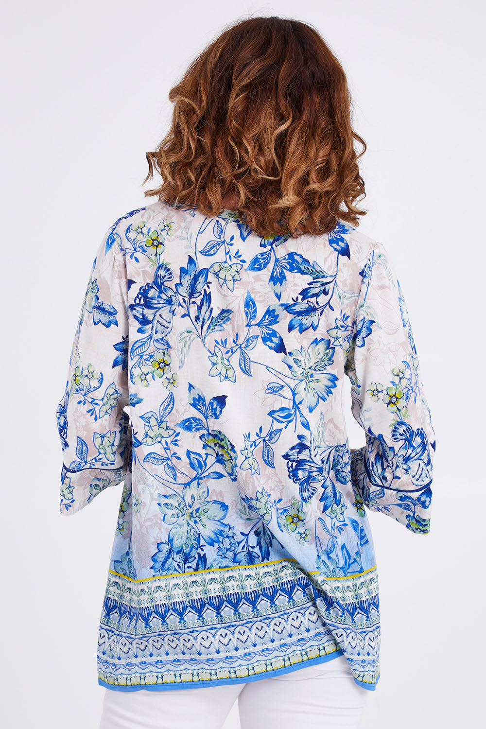 Model Emma wearing size 10 of the Rhodes Pleated Top in colour Print (Blue), from the back