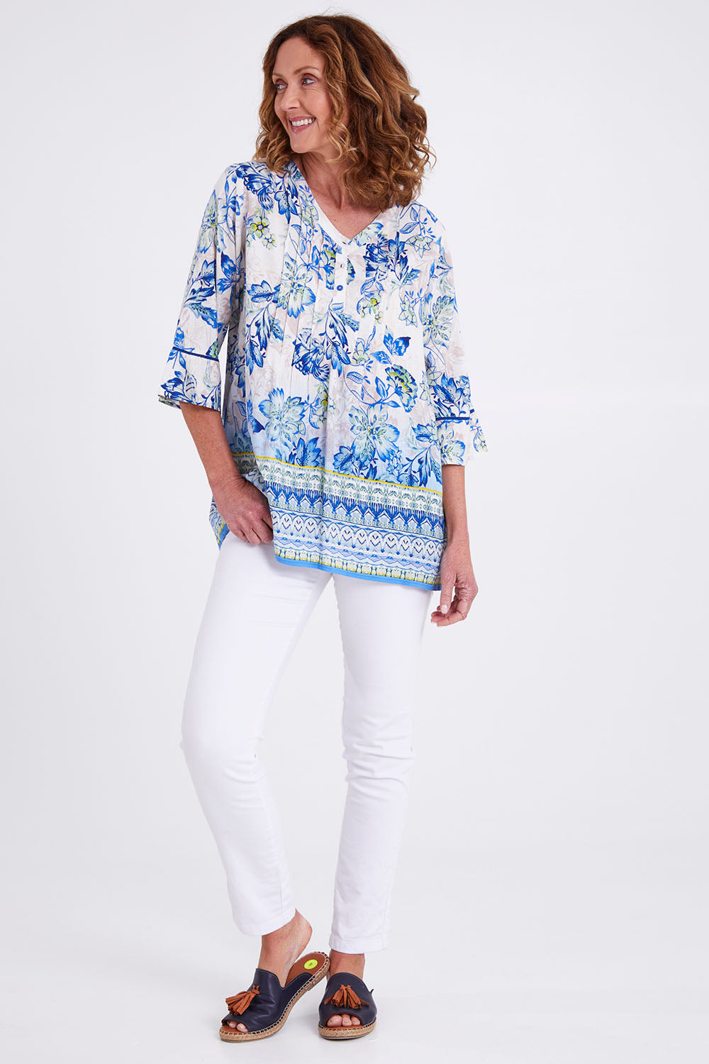 Model Emma wearing size 10 of the Rhodes Pleated Top in colour Print (Blue), from the front, showing the whole outfit