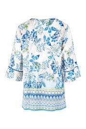 Product shot of the Rhodes Pleated Top in colour Print (Blue), from the back
