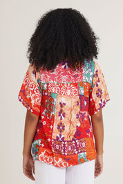 Model Ziara wearing size 10 of the Bib Top in colour Araya, from the back