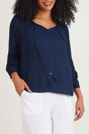 Model Ziara wearing size 10 of the Boho Top in colour Navy (Blue), from the front, cropped image