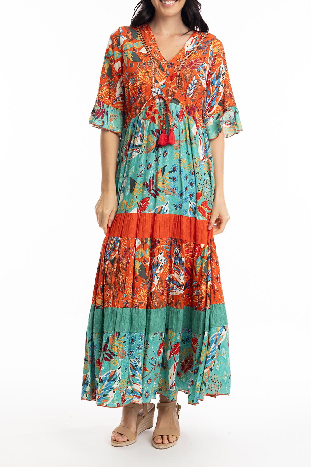 A model wearing the Serengetti V Neckline Dress in colour Red (Green), from the front, cropped image