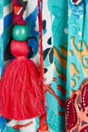 Product shot of the Serengetti V Neckline Dress in colour Red (Green), detail