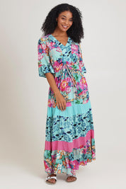 Model Ziara wearing size 10 of the Vin colourNeckline Layers Maxi Dress - Selaron, from the front, showing the whole outfit