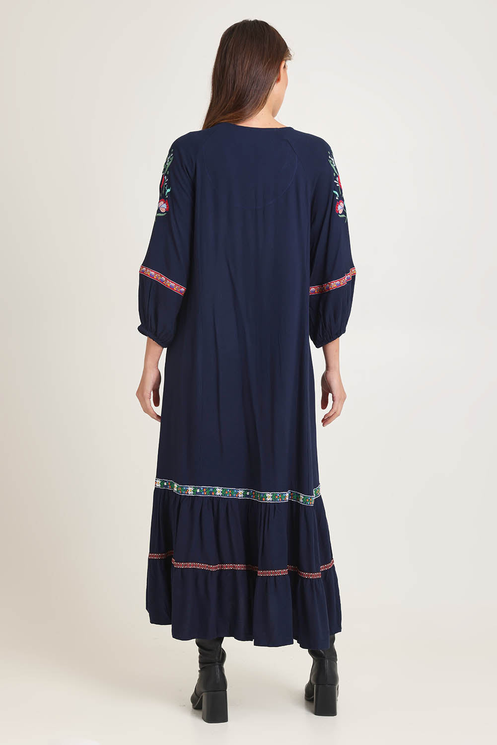 Model Madeline wearing size 10 of the Embroidered Maxi Dress in colour Ivanova (Blue), from the back