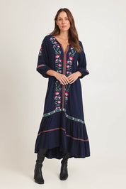 Model Madeline wearing size 10 of the Embroidered Maxi Dress in colour Ivanova (Blue), from the front, showing the whole outfit