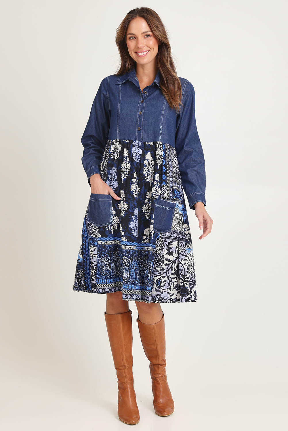Model Madeline wearing size 10 of the Denim Mix Dress in colour Bhadoi (Blue), from the front, showing the whole outfit