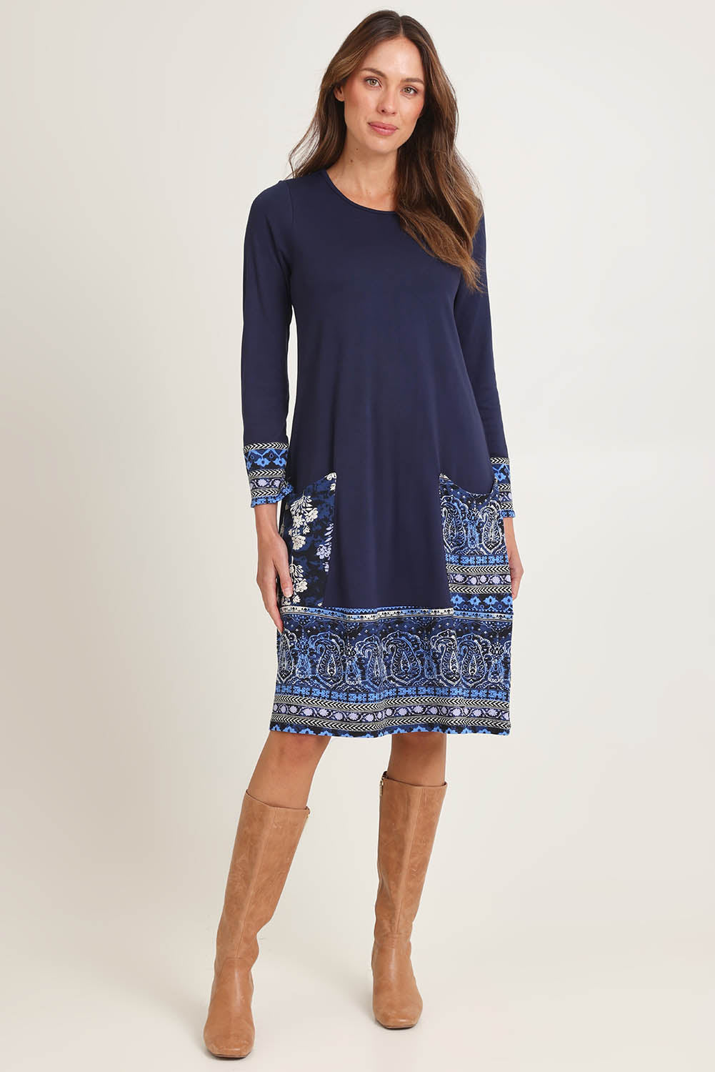 Model Madeline wearing size 10 of the Solid Body Patch Dress in colour Bhadoi (Blue), from the front, showing the whole outfit