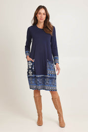 Model Madeline wearing size 10 of the Solid Body Patch Dress in colour Bhadoi (Blue), from the front, showing the whole outfit