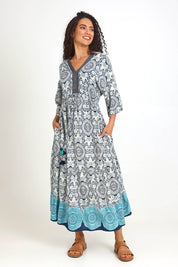 Model Pamelar wearing size 10 of the V Maxi Dress – Print in colour Print, from the front