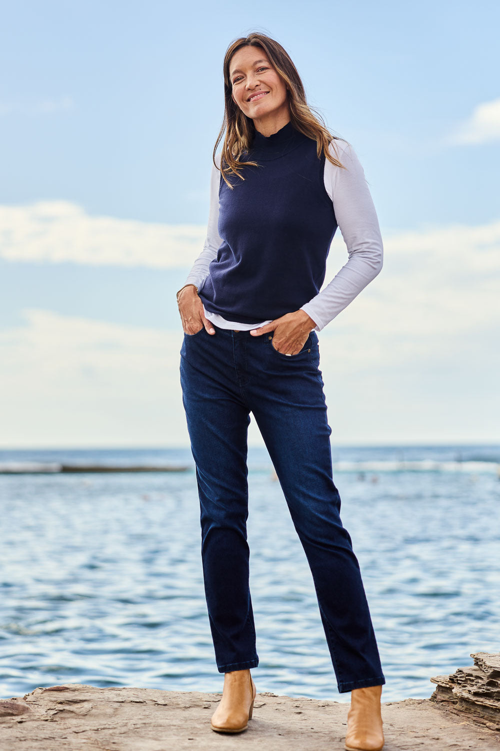 Model Alex wearing size 10 of the Essentials Straight Leg Denim Jeans in colour Dark (Blue), from the front, showing the whole outfit