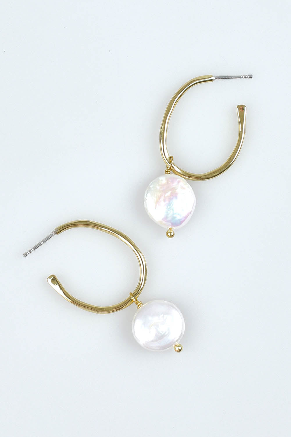 A model wearing the Perfect Gold Pearl Hoop Earrings in colour Goldpearl (Metallics), from the front, showing the whole outfit