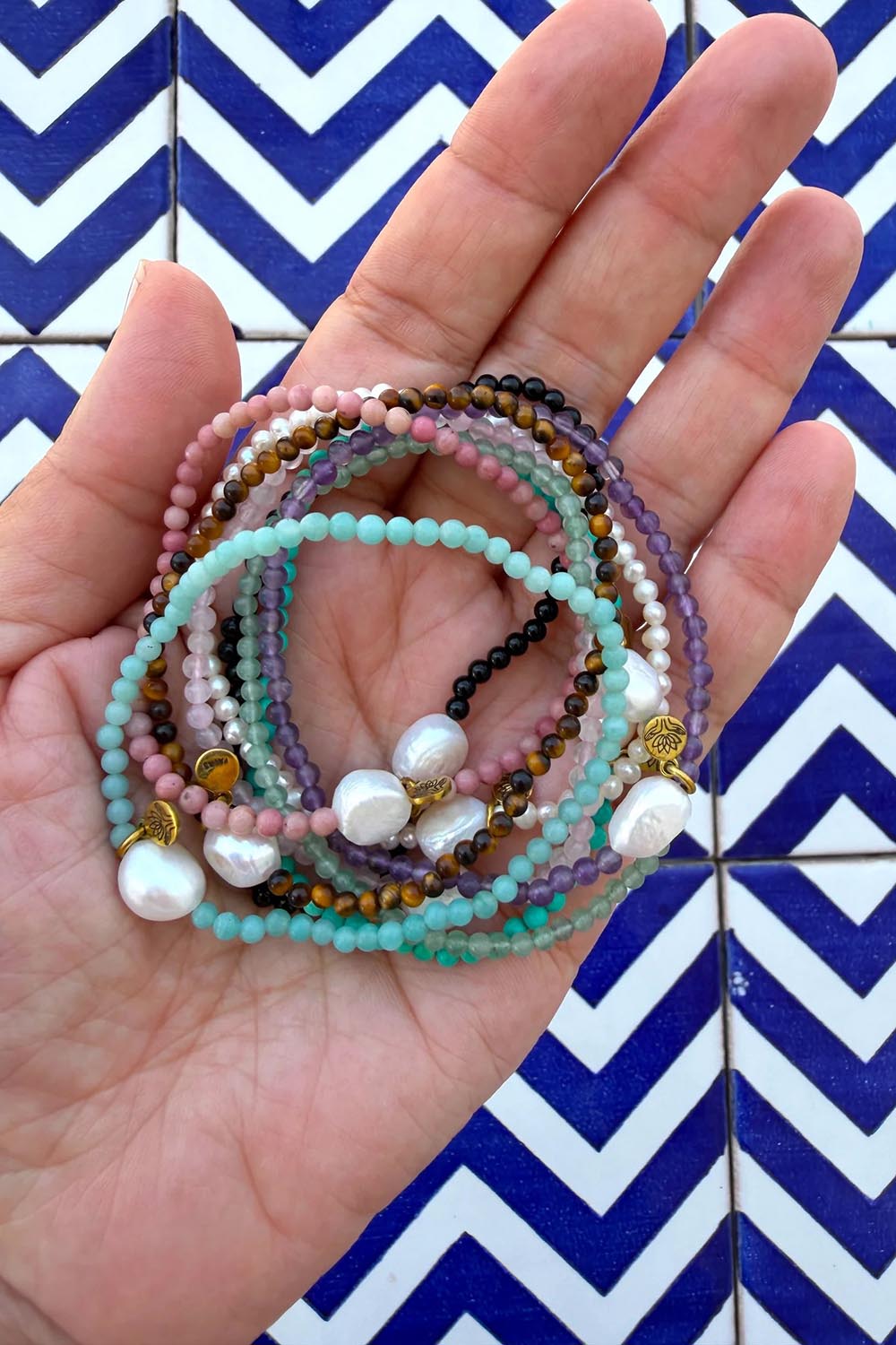 Product shot of the Luna Pearl Bracelet - Rhondonite in colour Rhondonite, from the back