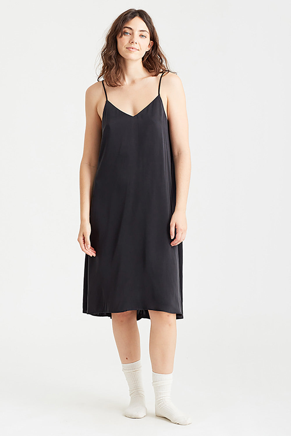 A model wearing the Audrey Silk Slip Nightie in colour Black (Black), from the front, showing the whole outfit