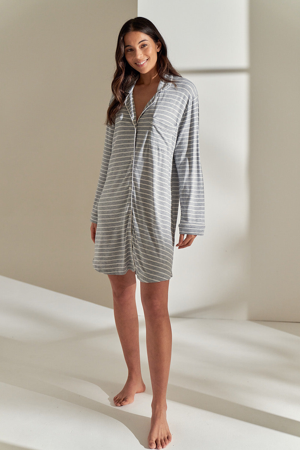 A model wearing the Modal Soft Kate Nightshirt in colour Greystripe (Grey), from the front, showing the whole outfit