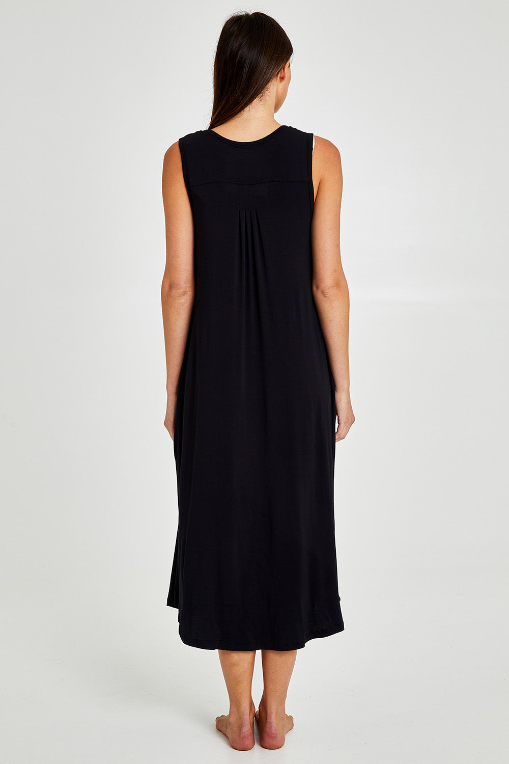 Model Madeline wearing size S of the Kate Modal Soft Pleat Front Maxi Nightie in colour Black (Black), from the back