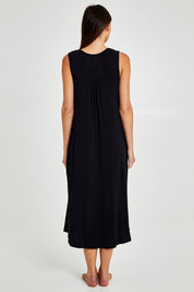 Model Madeline wearing size S of the Kate Modal Soft Pleat Front Maxi Nightie in colour Black (Black), from the back