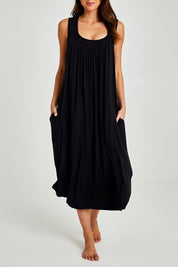 Model Madeline wearing size S of the Kate Modal Soft Pleat Front Maxi Nightie in colour Black (Black), from the front, cropped image